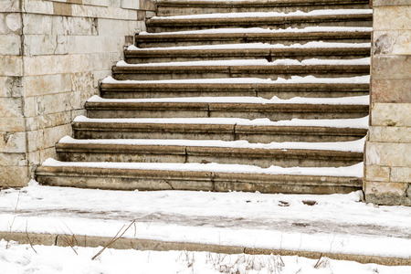 Steps in the snow in winterの写真素材