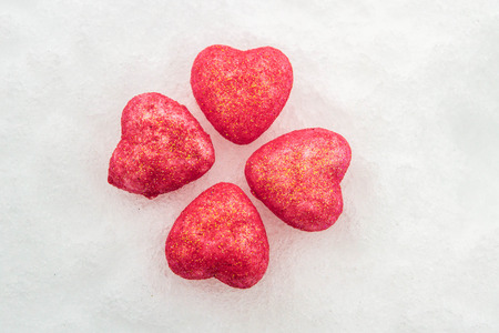 Pink hearts in the snowの写真素材