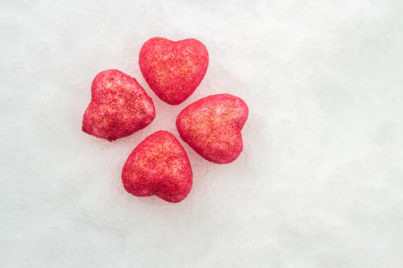 Pink hearts in the snowの写真素材