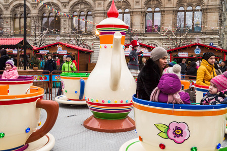 Moscow, Russia, March 7, 2015. Attraction cups of tea spinning in a circle.のeditorial素材