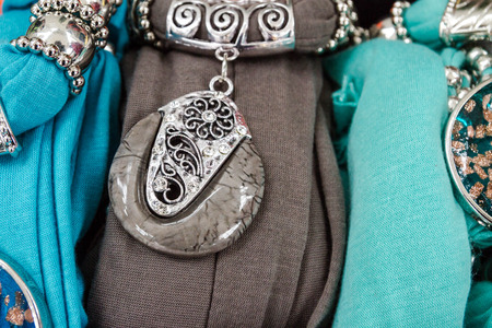 The decoration of stone and metal on the viscose scarf