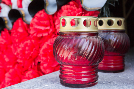 Commemorative Burgundy candle re wreaths at the memorial wall of remembranceの写真素材