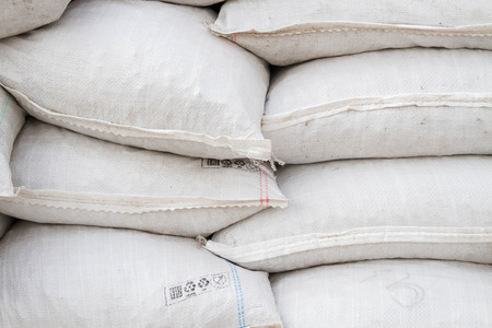 White sand bags on the basis of an open constructionの写真素材