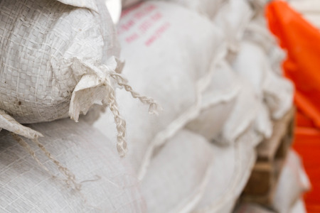 White sand bags on the basis of an open constructionの写真素材