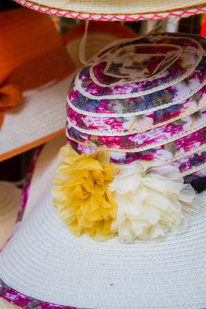 Summer colorful women's hats decorated with ribbons and stonesの写真素材