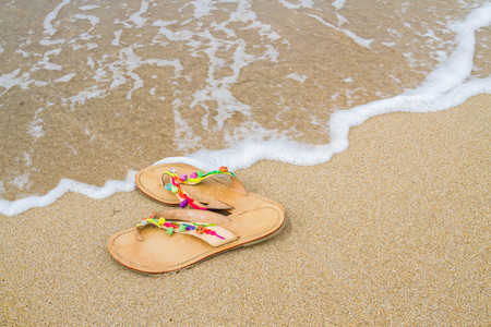 Summer flip flops on the beach