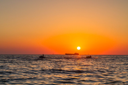 Beautiful sunset on the black seaの写真素材
