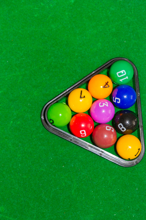Children's pool table game with multicolored balls