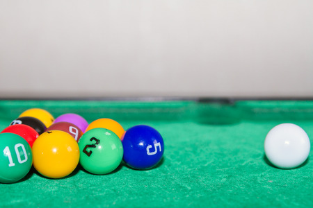 Children's pool table game with multicolored ballsの写真素材