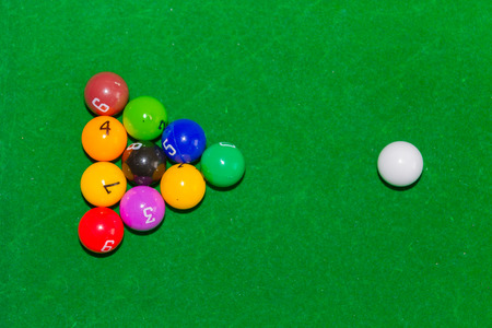 Children's pool table game with multicolored balls