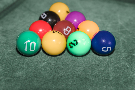 Children's pool table game with multicolored balls