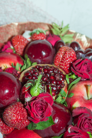 Bright red beautiful bouquet of fruits and flowersの写真素材