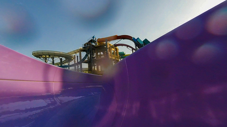 Water color attraction slide with water splashes in an outdoor water Parkの写真素材