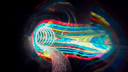 Water colored attraction slide inside the colorful pipeの写真素材