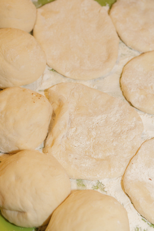 Dough for pastries buns are prebaked for bakingの写真素材