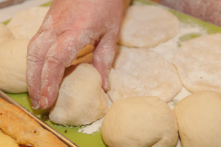 Dough for pastries buns are prebaked for bakingの写真素材
