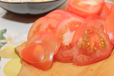 Ingredients for the pie sliced rings of red tomatoesの写真素材