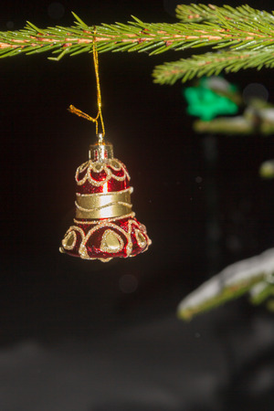 Christmas tree toy weighs on the tree at night in winterの写真素材