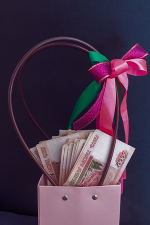 A large pack of Russian money lies at the gift packageの写真素材