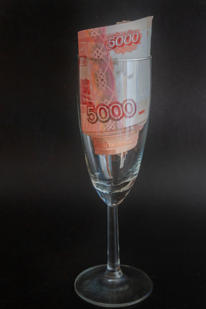 A large pack of Russian money rolled in a glassの写真素材