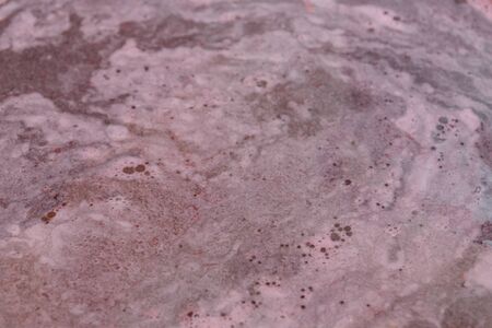 Adding sugar to the berry syrup that is cooked on the stove