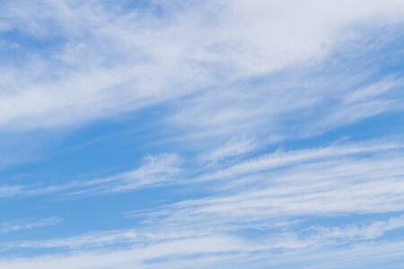 White fluffy clouds in the blue sky in summerの写真素材