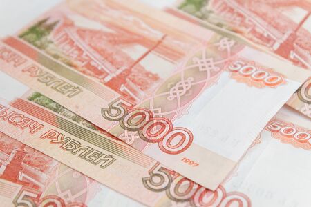 The Russian five-thousandth banknotes lie on the tableの写真素材