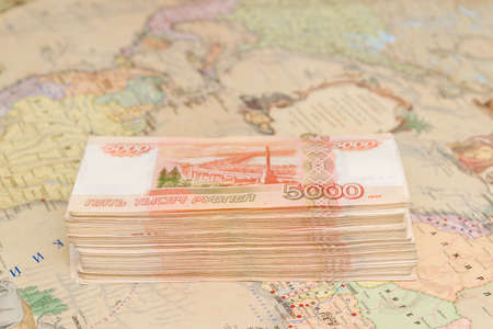 A large wad of Russian money is on the map of the worldの写真素材
