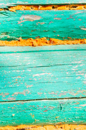 The wall of an old wooden painted house