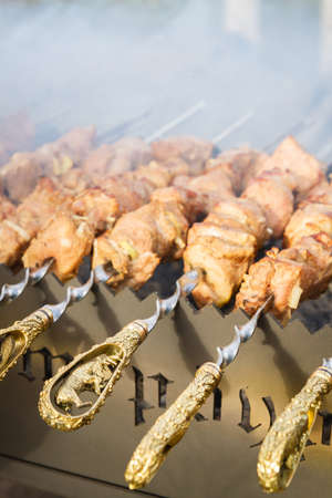 Shish Kebab made from pieces of pork is cooked on skewers on the grillの写真素材