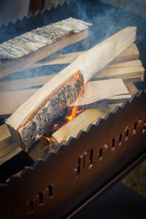 Dry wood in the grill for kindling and making coalsの写真素材