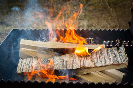 Dry wood in the grill for kindling and making coalsの写真素材