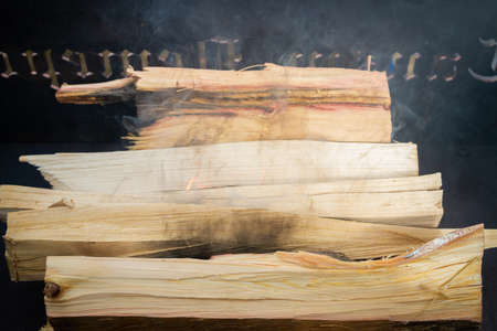 Dry wood in the grill for kindling and making coalsの写真素材