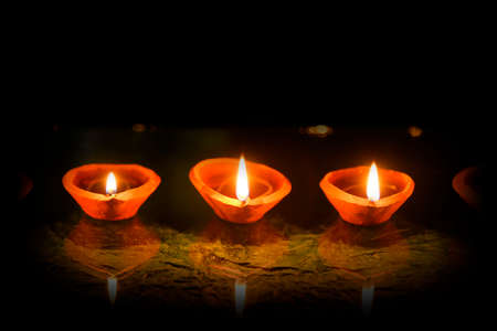 Happy Diwali - Diya lamps lit during diwali celebration
