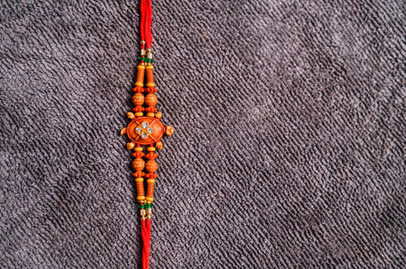 Indian festival: Raksha Bandhan background with an elegant Rakhi. A traditional Indian wrist band which is a symbol of love between Brothers and Sisters.の写真素材
