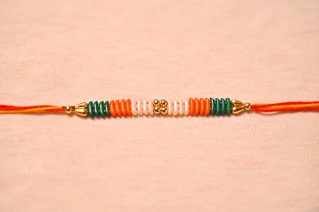 Raksha Bandhan : Rakhi with orange and green threadの写真素材