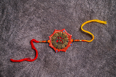 Indian Festival Dussehra, showing golden flower with colorful kumkum on fabric backgroundの写真素材