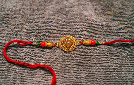 Indian festival: Raksha Bandhan background with a Rakhi. A traditional Indian wrist band which is a symbol of love between Brothers and Sisters.の写真素材