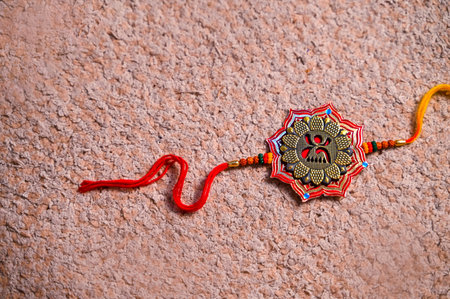 Indian festival Raksha Bandhan background with an elegant Rakhi. A traditional Indian wrist band which is a symbol of love between Brothers and Sisters.の写真素材