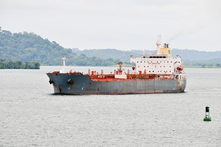 Cargo ship moving to the locks in the Panama Channelのeditorial素材