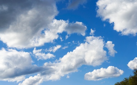 White clouds in the blue sky in early spring