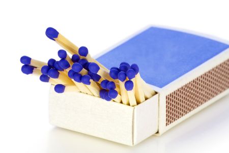 Match boxes and a match with dark blue heads macro. Isolated on white.の写真素材