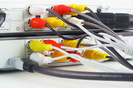 The modern DVD  players close-up  with connected analog and gigital video and audio cables