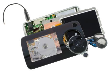 Cracked disassembled  broken audio video compact digital player. Isolated on white. Mass production....