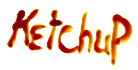 The isolated word "Ketchup" is written by ketchup on a white background.の写真素材