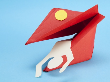 Paper red  monster from a rough paper eats the man. Dangers concept. Cyan background.の写真素材
