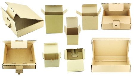 Set of opened cardboard boxes for an industrial packaging of spare parts isolated on white