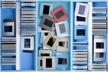 Blue boxes with old dusty negatives and slides backgroundの写真素材