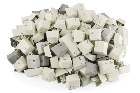 Heap of keys and buttons from standart keyboards. Isolated on white with patchの写真素材
