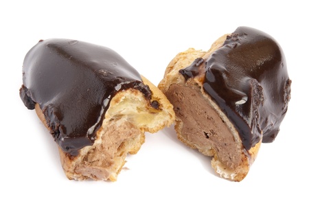 On a white napkin with a rough friable surface the piece a chocolate cake the Eclair lies
